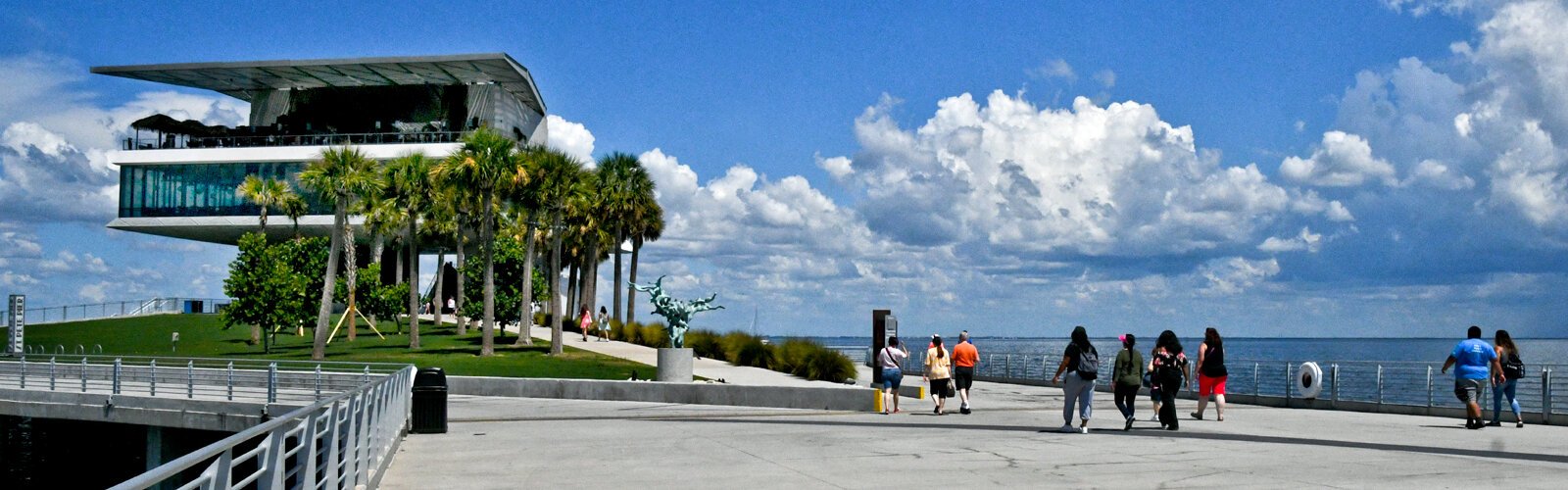 Visitors are welcome to Pier Point by the water-like bronze sculpture “Olnetopia” by Belgian artist Nick Ervinck.