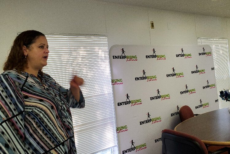  Ileana Cintron, deputy director of Enterprising Latinas, gives a tour of a classroom at the Wimauma Opportunity Center.