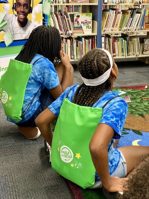 Dunbar Elementary students in the Sing Out and Read (SOAR) program sit and listen during the recent event celebrating their hard work.