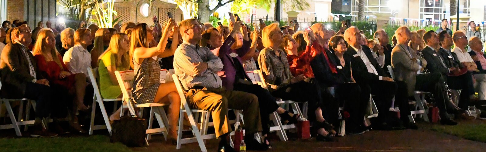 An appreciative audience uses cell phones to capture the swinging of the Ars Sonora bells during the concert grand finale.