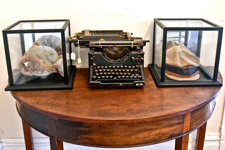 Colonel Robins’ Underwood typewriter and his hat and cap from his time with the Red Cross in Russia.