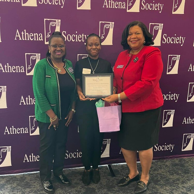 Grant winner Annetta Hawkins poses between Athena Society President Denise Jordan and Career Assistance Grants Committee Chair Judge Mary Scriven.