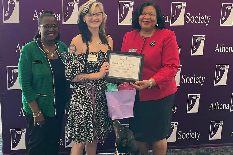 Phyllis Marshall Career Assistance Grant winner Natalie Rychel with Athena Society President Denise Jordan, Career Assistance Grants Committee Chair Judge Mary Scriven and Athena the ADA service dog.