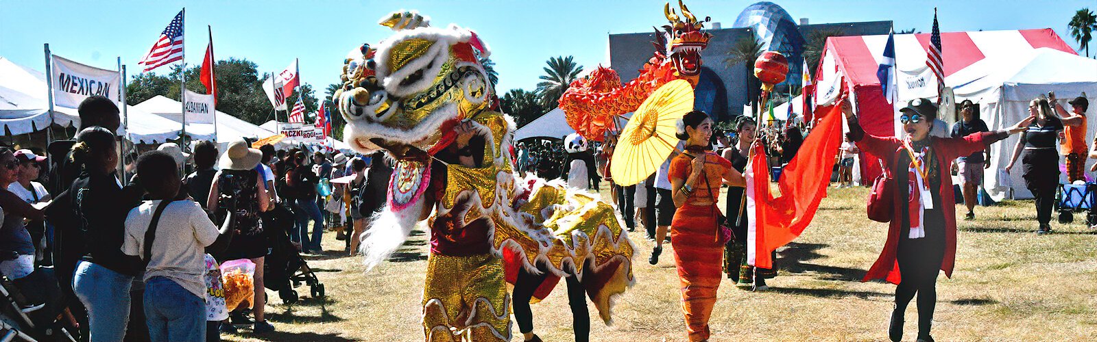 The Taiwanese lion, followed by the Chinese dragon, entertain the crowd as they parade during the 47th annual International Folk Fair.