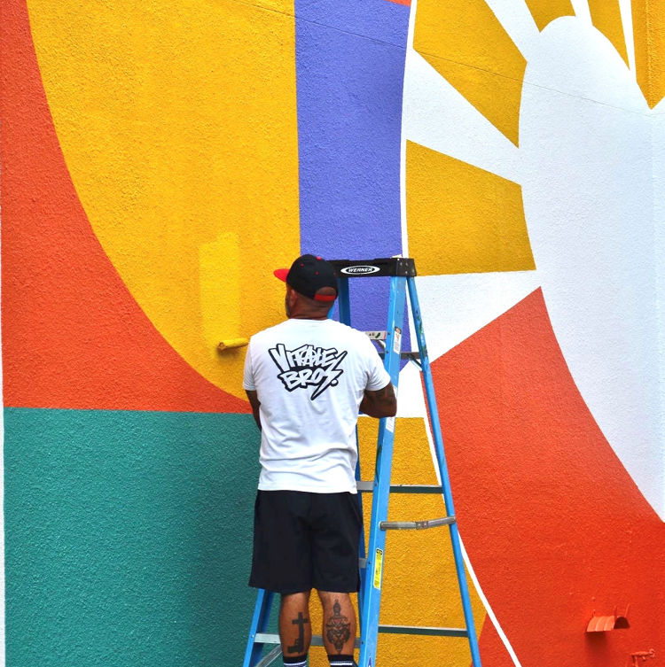 Vitale Bros. painted the mural "Rise and Shine" on the wall of Parc Center for Disabilities as a Bright Spot Community Project during the SHINE Mural Festival.