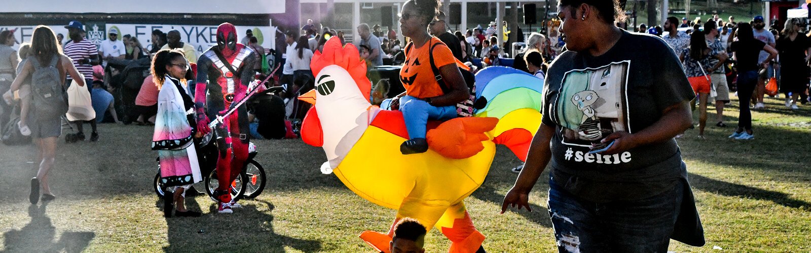 Halloween celebrants show off some eye-catching costumes during the Riverwalk Trick or Treat event. 