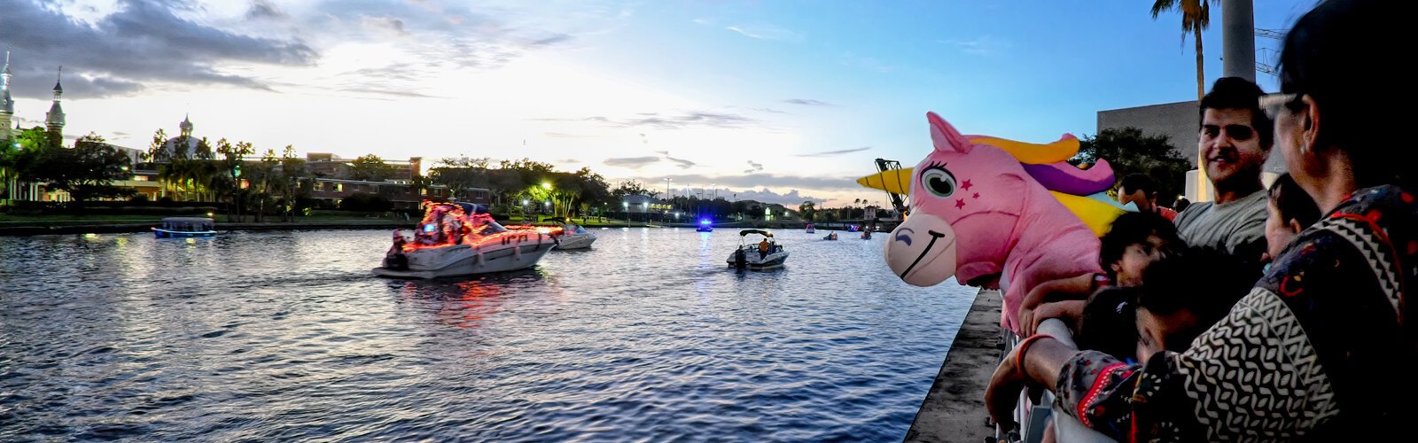 Families enjoy the Halloween Lighted Boat Parade at sunset along the Hillsborough River.