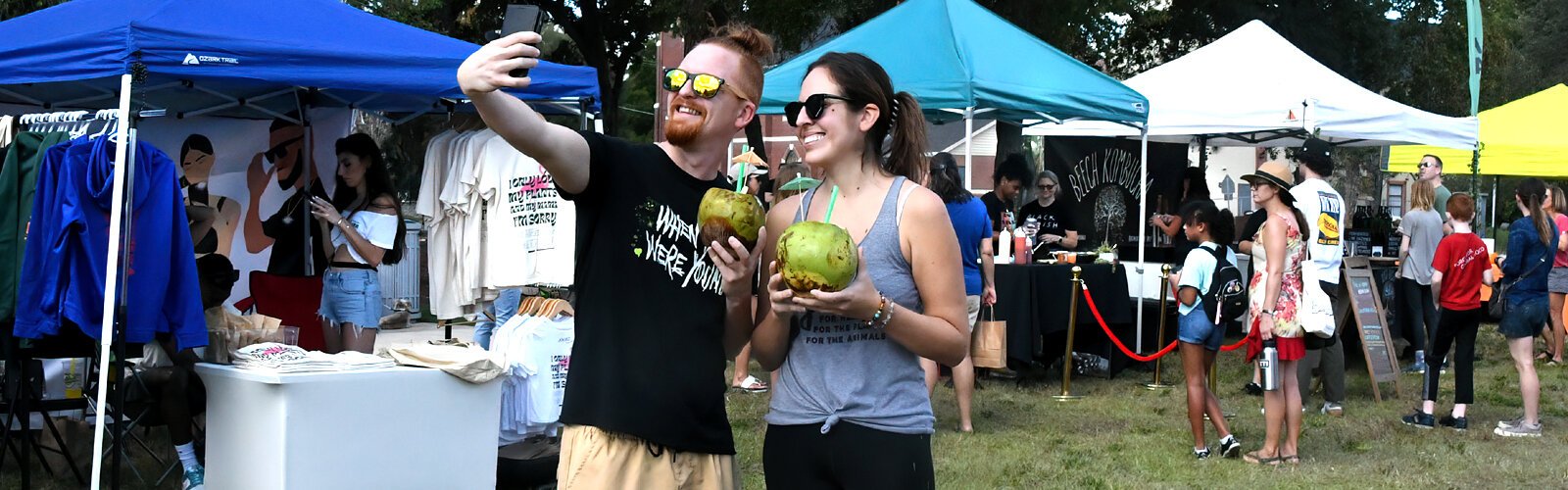 A couple with fresh coconuts in hand takes a selfie to mark the day at the 11th annual Tampa Bay VegFest, an event celebrating all things healthy, compassionate and environmentally sustainable.