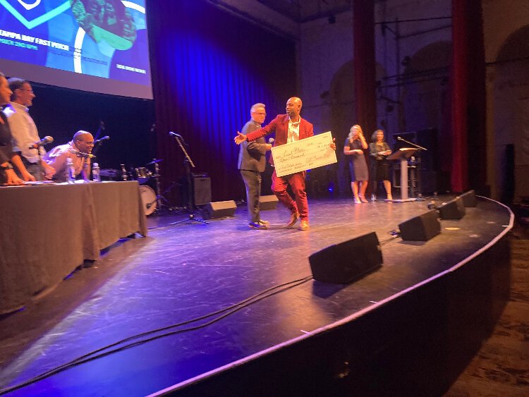 Barbershop Book Club founder Antonio Brown, owner of Central Station Barbershop & Grooming, thanks the judges after winning first place at the SVP Tampa Bay Fast Pitch event.