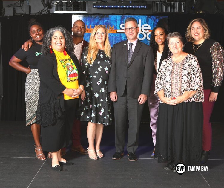 Leaders of the nonprofit organizations from Social Venture Partners Tampa Bay's Fast Pitch program stand with Community Foundation Tampa Bay Senior Vice President Community Impact Jesse Coraggio.