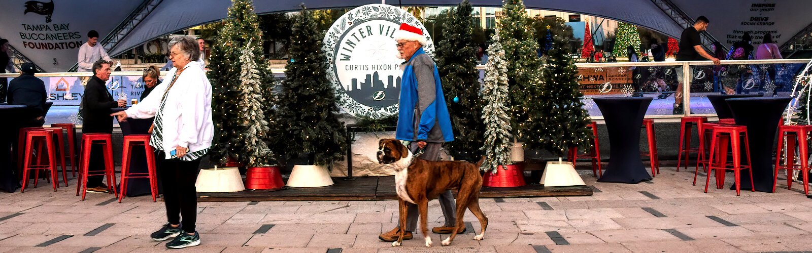 People come celebrate the holiday season at Winter Village, free to attend and open to all ages as well as to leashed pooches.