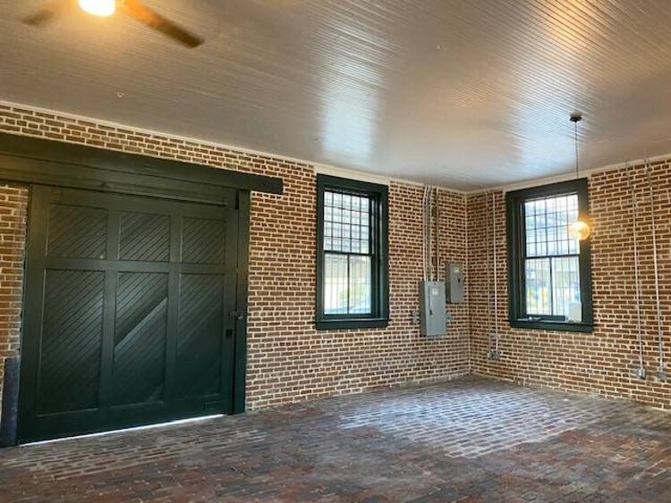 The renovation of the Tampa Union Station baggage building included electrical upgrades, new sliding doors, new windows and restoration of areas of the floor with period-era pavers.