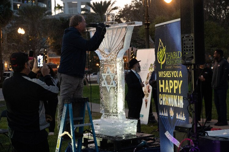 Sculpting the ice menorah at the 20th annual Hanukkah in the City at South Straub Park in St. Petersburg