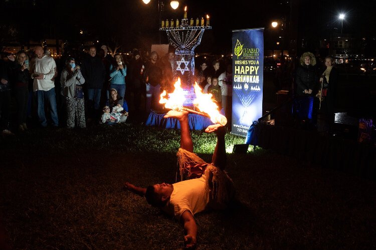 Fire dancers were part of the entertainment at the Chabad Jewish Center of Greater St. Petersburg's Hanukkah in the City celebration.