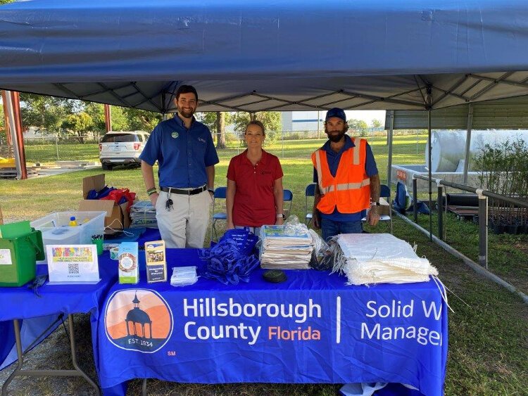 Danny Gallagher, recycling coordinator for Hillsborough County, Kim Byer, director of the county's Solid Waste Management Department, and  Ronald Wiggins, a general maintenance worker, at an Earth Day compost giveaway event.