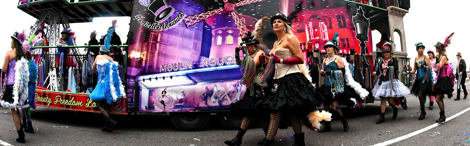 The Moulin Rouge float with Les Belles Femmes participate in the Gasparilla parade of pirates, giving a whiff of French flair to the boisterous event.
