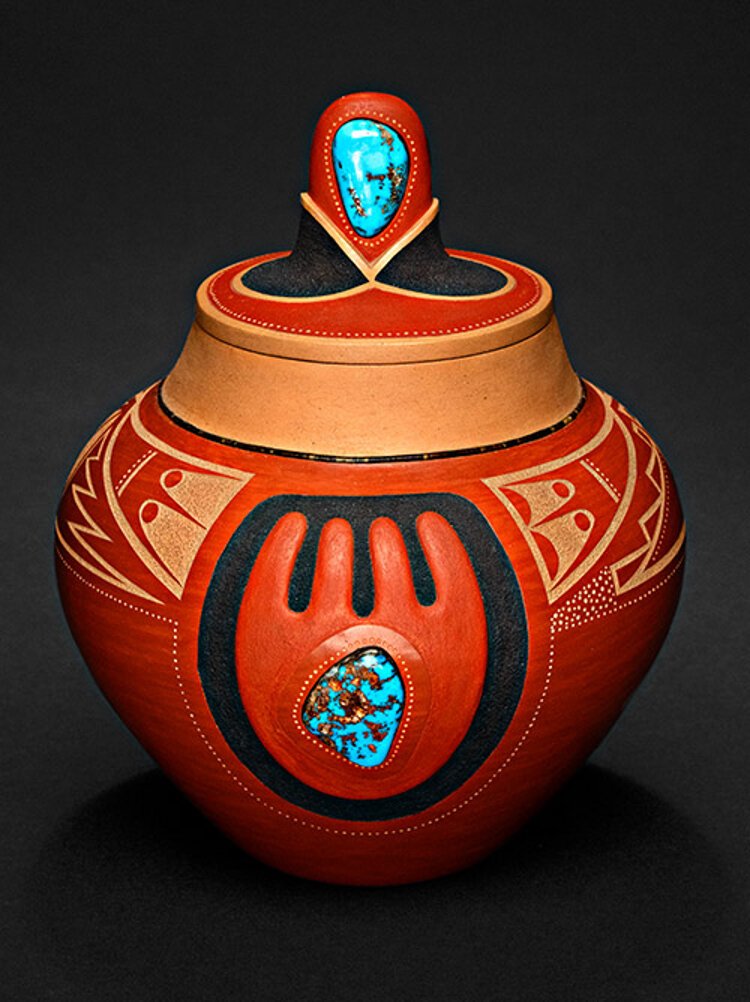 This jar by the late Native American artist Tony Da is part of the exhibit "The Stories They Tell: Indigenous Art and the Photography of Edward S. Curtis" at The James Museum.