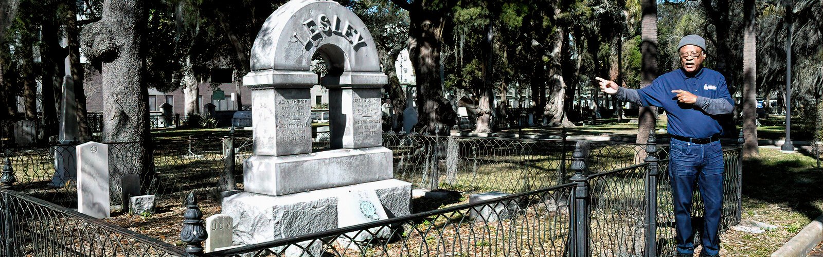 Historian Fred Hearns points to the grave site of John Thomas Lesley, a captain in the Confederate Army and later the 12th mayor of Tampa. Lesley owned several enslaved persons and one of them was the first dead buried, nameless, at Oaklawn Cemetery.