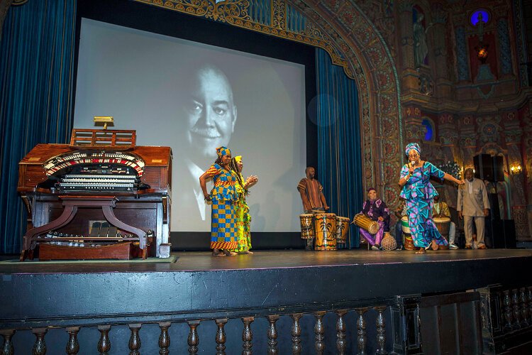 Kuumba Dancers and Drummers surprised attendees by entering from the back of the theater before taking the stage and engaging the audience.