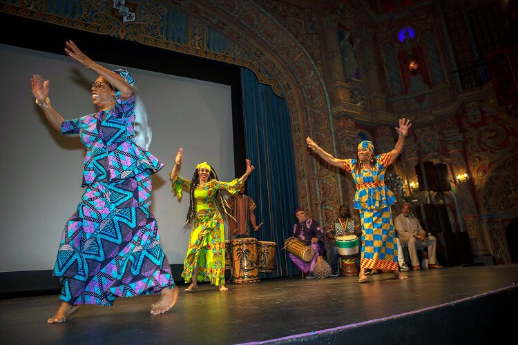 Kuumba Dancers and Drummers surprised attendees by entering from the back of the theater before taking the stage and engaging the audience.