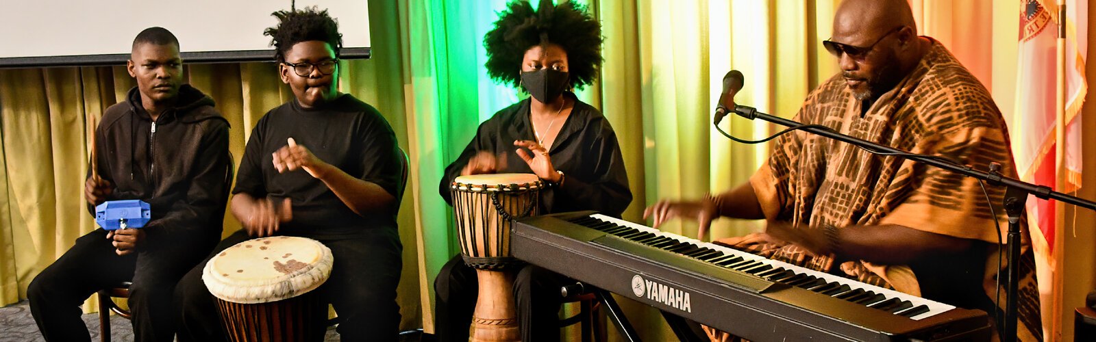  Accompanied by African drums, Maurice Allen performs at the piano during a musical interlude at the Tampa Bay History Center (TBHC) Black Month History Reception.