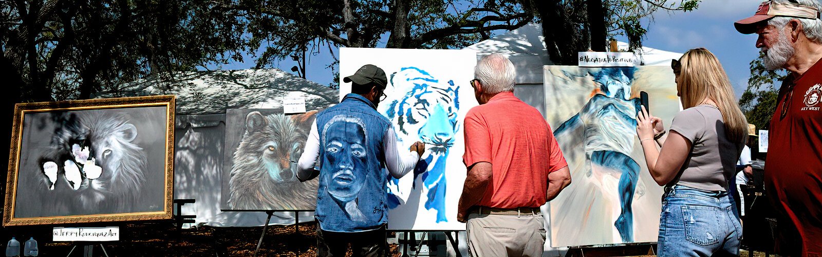 Jerry Rodriguez, who goes by the name JRcreates, works on a painting as part of the Gasparilla Festival of the Arts' Remote Studio, which shows visitors the creative process in action.