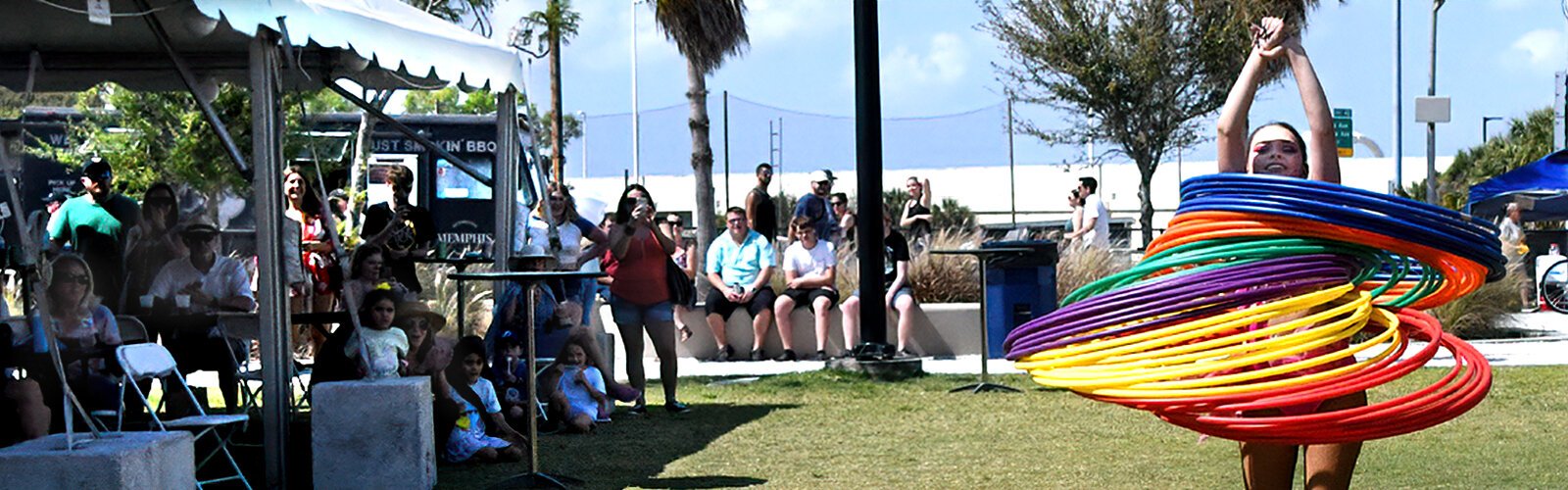  Cheyenne Hay, 16, almost disappears under four dozen hula hoops that she skillfully twirls around her whole body during her performance at the Gasparilla Festival of the Arts.