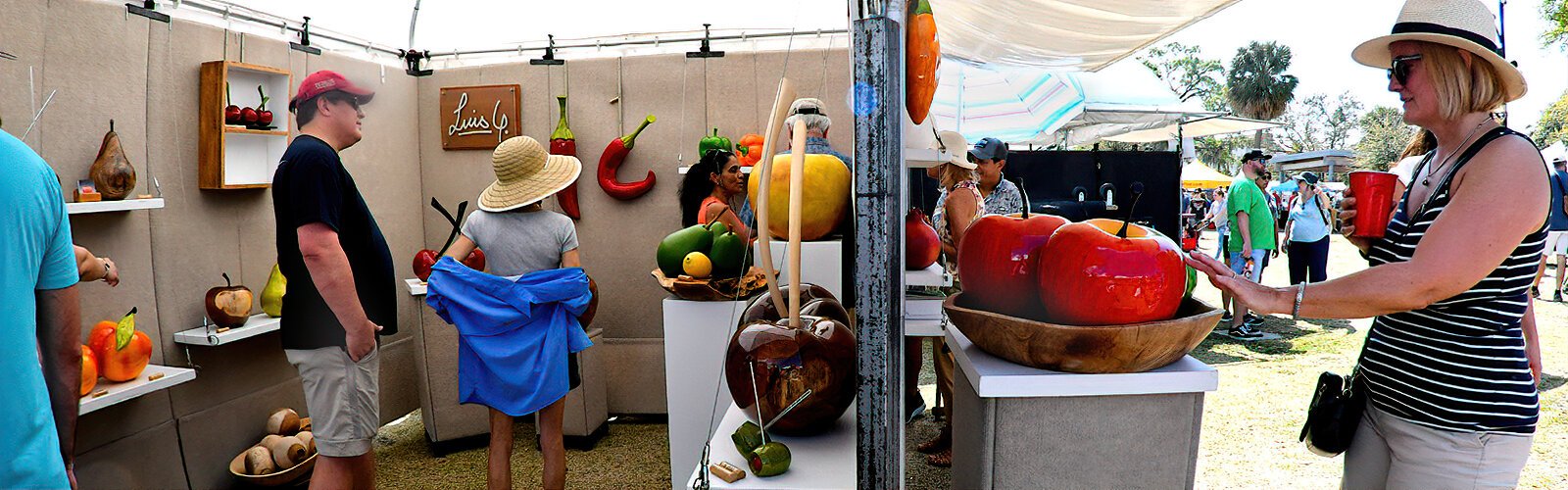 The decorative display of oversized glossy ceramic fruit by artist Luis Guttierez attract festival goers like bees to honey at the 53rd Annual Gasparilla Festival of the Arts at Julian B. Lane Riverfront Park.