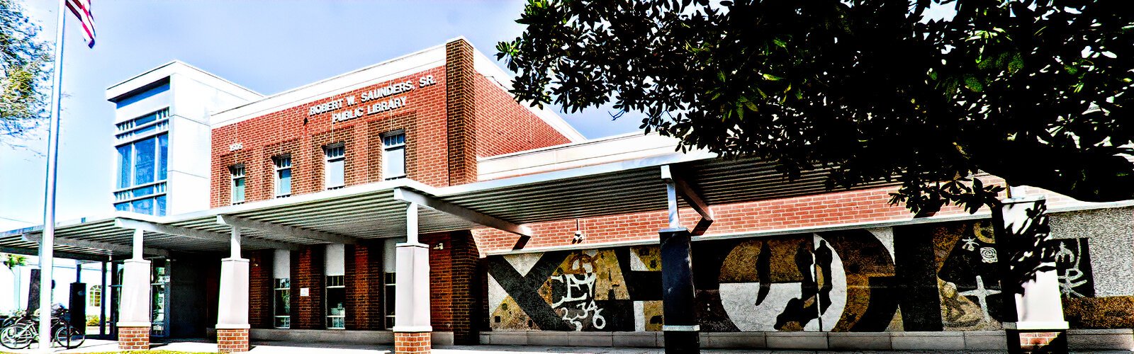 The Robert W. Saunders, Sr. Public Library is one site on the newly-launched Tampa Soulwalk heritage trail. Originally known as the Ybor City Branch Library, the facade is adorned with the mosaic“Symbols of Mankind" by Tampa native Joe Testa-Secca.
