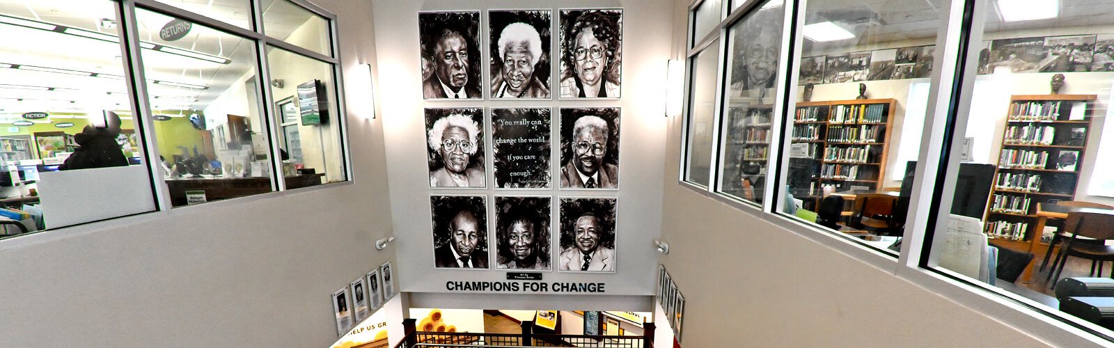 The staircase leading to the second floor of the Robert W. Saunders, Sr. Public Library is adorned with artist Princess Smith’s “Champions for Change," an oil finger-painting on canvas that features a selection of influential civil rights activists 