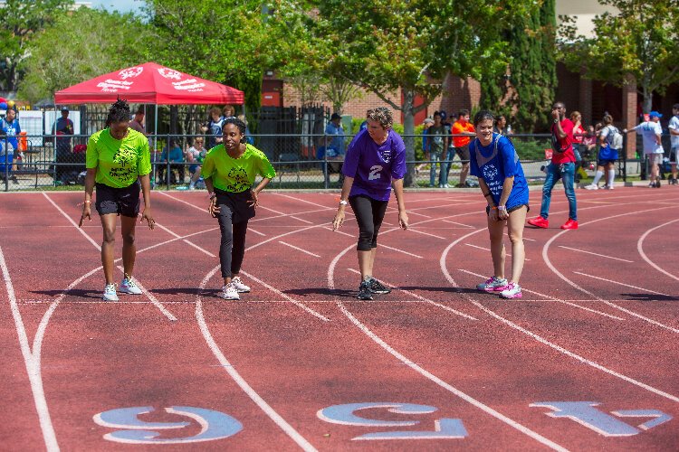 Athletes line up to race in the 100 meters at the ​Special Olympics Hillsborough-Pinellas County Summer Games. 