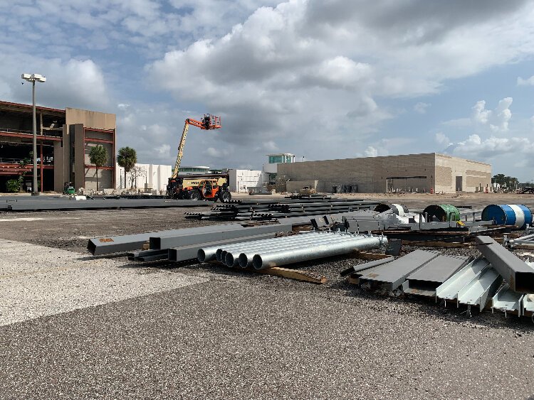 At the front of RITHM, a Sprouts Farmers Market and Burlington department store are being built on the spot where a nearly half-century-old big box store that housed Dillard’s Clearance Center once stood.