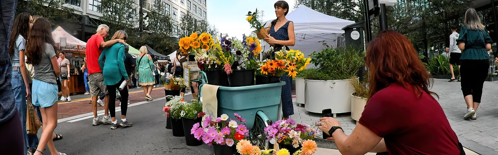 During The Market at Water Street Tampa, Swiss-born Kali Rabaut prepares cheerful bouquets with flowers that come from farmers as well as her own garden.