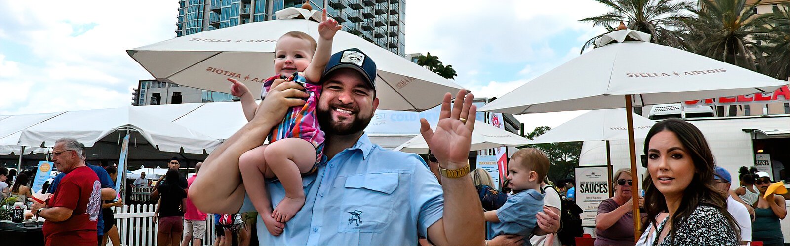  Danny and his one-year-old daughter, Harlyn, joyfully participate in Tampa Riverfest, an annual event produced by Friends of the Riverwalk that features family-friendly activities, marketing/promo tents, musicians and more.