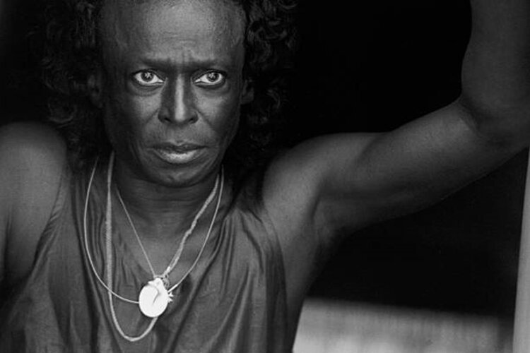 An exhibition at the Leepa-Rattner Museum of Art displays the work of the late photographer Herb Snitzer, who was known for his photographs of jazz legends like Miles Davis, pictured here backstage at the 1990 Newport Jazz Festival.