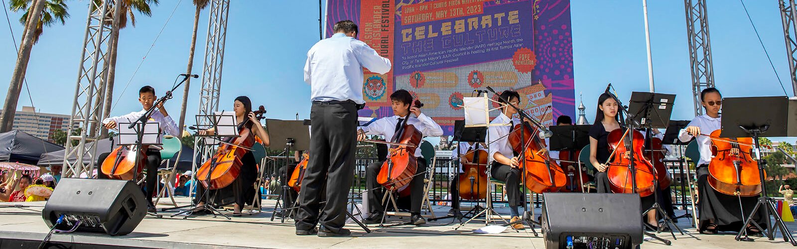 Students from Tampa's AllMay Music Studio perform "America the Beautiful" during the City of Tampa's Asian Pacific Islander Cultural Festival at Curtis Hixon Waterfront Park.