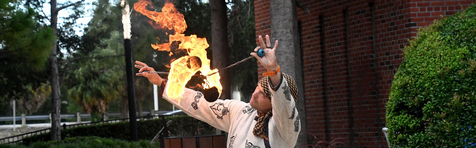 Dancing with fire, David Buczynski demonstrates the art of Fire Poi at the Dance Now festival in Water Works Park in Tampa.