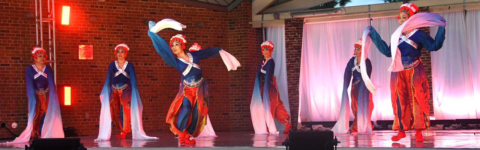 Chinese dancers of the Sunshine Dance Group perform “Deep Night," a tale of older Asian ladies dreaming of a better life in ancient China.