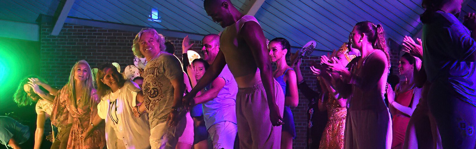 Flanked by Shana Corrada and Santiago Corrada, President and CEO of Visit Tampa Bay, Tampa City Ballet Artistic Director Paula Nunez takes a bow with all the performers of Dance Now, TCB’s first annual cultural dance festival.