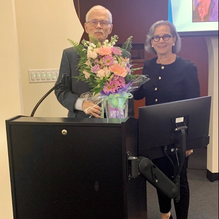 Judge Rick Nielsen presents the Brian McEwen Award to Judge Katherine Essrig.