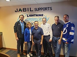 Larry Cooper and Children's Home Network team members at the April Tampa Bay Lightning game when Cooper was honored as a ampa Bay Lightning Community Hero.