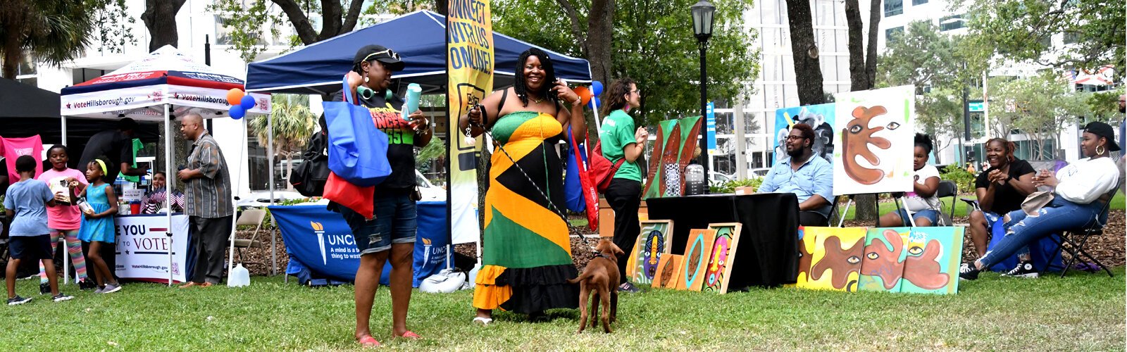 Event goers enjoy themselves at the Juneteenth festival, which included self-taught painter and digital artist Jaurice Moore and his Afro-futuristic art.
