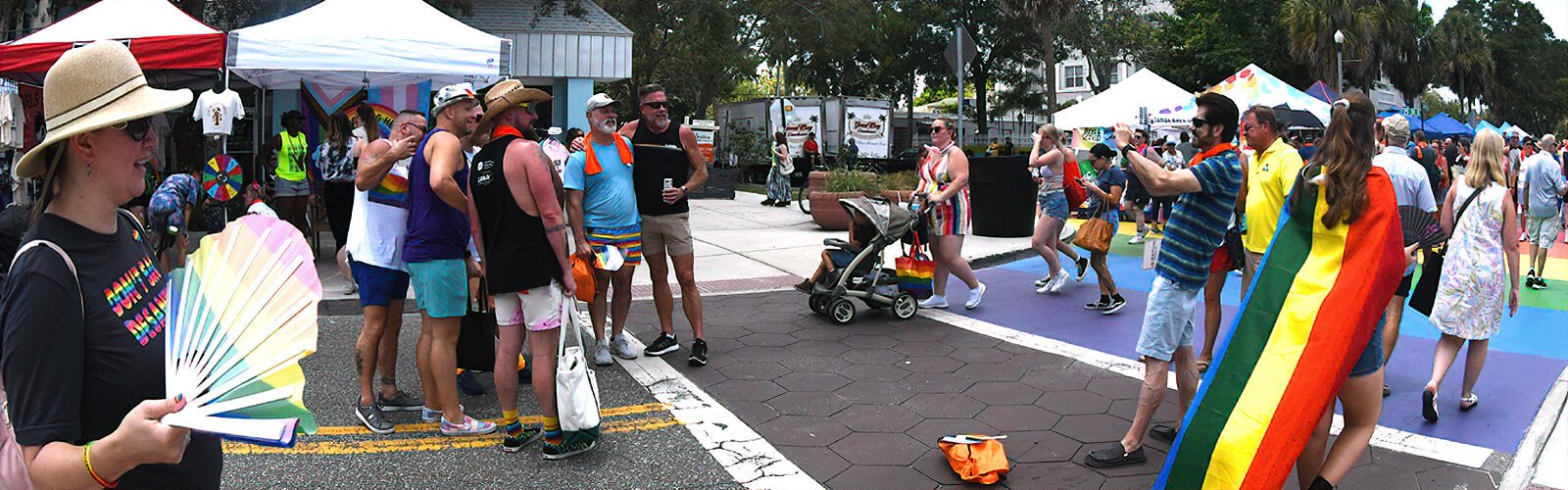 Friends enjoy busy Central Avenue and pose for a picture during the St Pete Pride street festival.