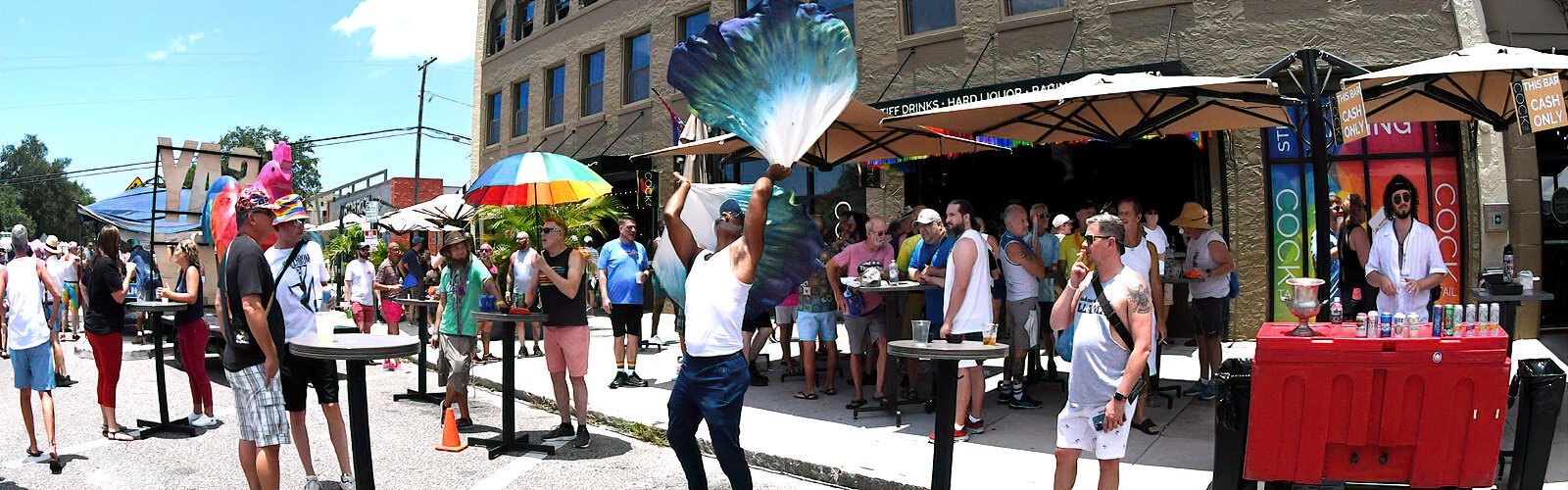  A roaming street performer entertains outdoor patrons at the Cocktail St Pete LGBTQ bar on Central Avenue.