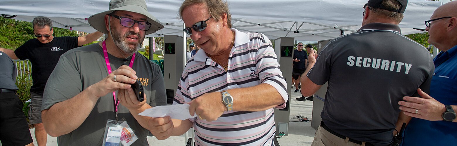 Frank Gaffney scans tickets for Cheap Trick at The Sound in Clearwater. The concert was free, but attendance was limited due to demand.