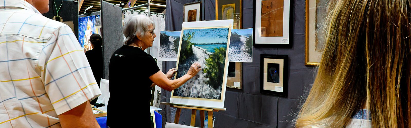 Artist Lorraine Potocki, an instructor at the Dunedin Fine Art Center, gives a demonstration of her technique in pastels to interested visitors at PAVA’s Cool Art Show.