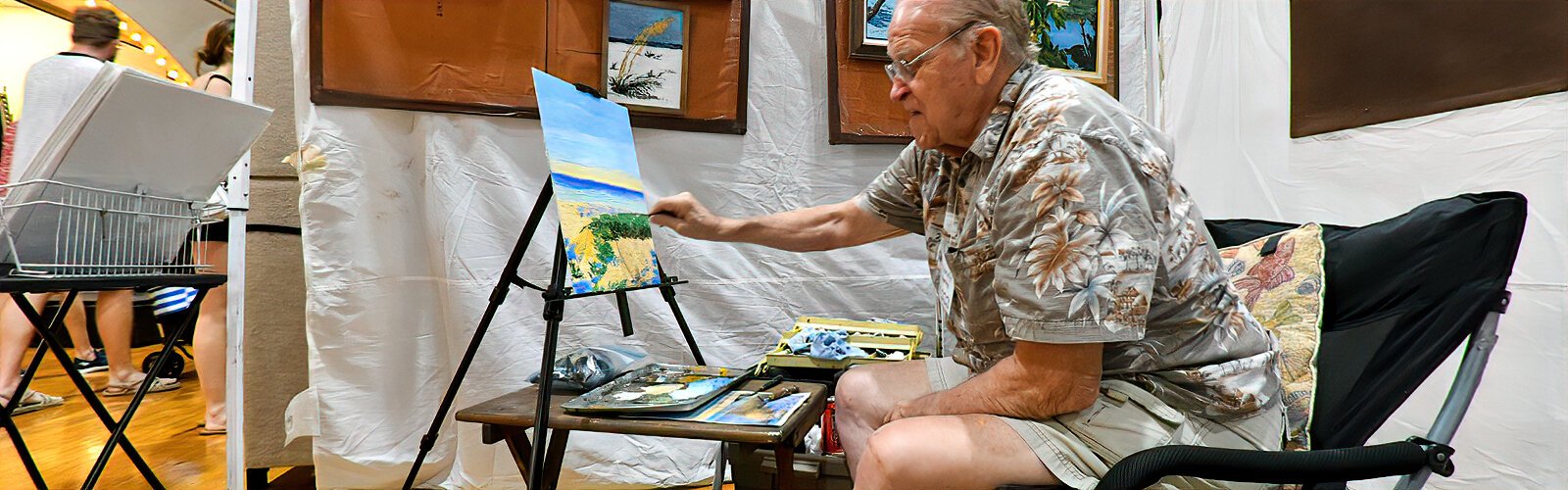 Using a palette knife, artist Randy Deering paints one of his favorite Floridian coastal scenes while participating in PAVA’s Cool Art Show in St Petersburg.