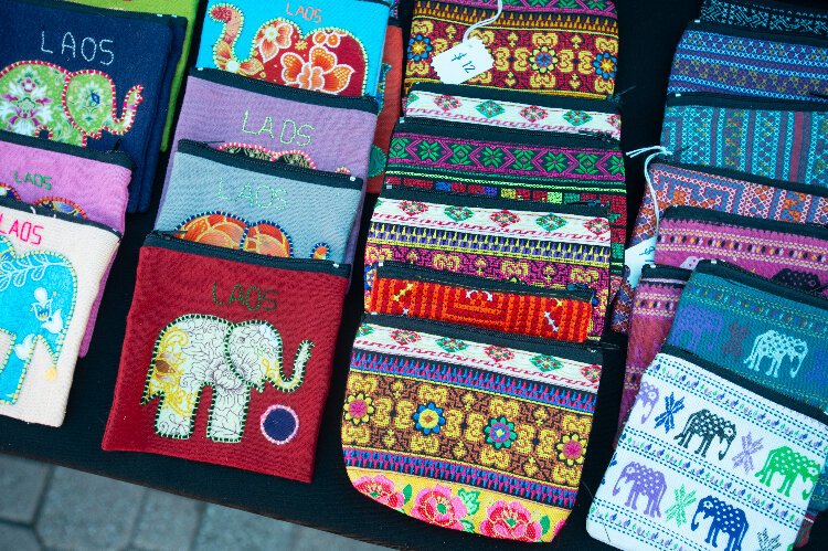 Items that Handcrafts from Laos and Thailand have for sale at the Ybor City Saturday Market include small zippered pouches