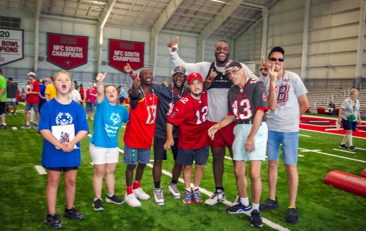 Tampa Bay Buccaneer Tackle Raiqwon O'Neal ran drills and posed for photos with Special Olympics Florida athletes as the team hosted its annual Community Impact Day.