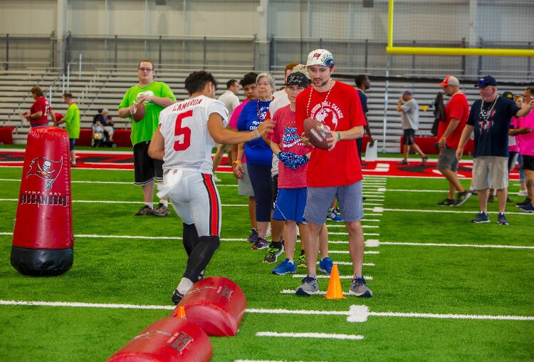 Tampa Bay Bucs Punter Jake Camarda ran drills with Special Olympics Florida athletes as the team hosted its annual Community Impact Day.